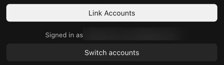 The foot of the link page: a wide Link Accounts button, a line that reads Signed in as followed by a blurred email address, and a Switch accounts button